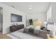 Bright main bedroom with ensuite bathroom, neutral walls, and a large window at 4945 Sanoma Vlg # B, Orlando, FL 32808