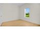 Well-lit bedroom with light wood floors and a window view at 1929 Sipes Ave, Sanford, FL 32771