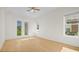 Bright bedroom with hardwood floors and French doors leading to the backyard at 1929 Sipes Ave, Sanford, FL 32771