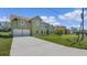 Two-story house with green exterior, driveway, and landscaping at 1929 Sipes Ave, Sanford, FL 32771