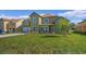 Two-story house with green exterior and a spacious lawn at 1929 Sipes Ave, Sanford, FL 32771