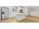 Modern kitchen with island, stainless steel appliances, and white cabinets at 1929 Sipes Ave, Sanford, FL 32771