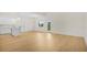 Open living room and kitchen with hardwood floors at 1929 Sipes Ave, Sanford, FL 32771