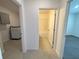 Bathroom with tub and shower, and a laundry area at 1112 Camden Way, Poinciana, FL 34758