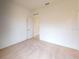 Well-lit bedroom with neutral colored carpet and closet at 1112 Camden Way, Poinciana, FL 34758