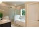 Spa-like bathroom with a soaking tub and walk-in shower at 204 Barrington Dr, Haines City, FL 33844