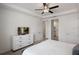 Bright and airy bedroom with modern furnishings, neutral tones, and a walk-in closet at 8951 Hilton Ridge Ave, Kissimmee, FL 34747