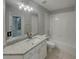 Bathroom featuring a granite vanity, white cabinets, and a shower-tub combination at 148 Blue Stone Cir, Winter Garden, FL 34787