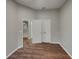 Bedroom showcasing wood floors, a closet, and neutral wall paint at 148 Blue Stone Cir, Winter Garden, FL 34787