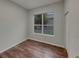 Bedroom featuring wood floors, a window, and neutral wall paint at 148 Blue Stone Cir, Winter Garden, FL 34787