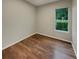 Bedroom featuring wood floors and a bright window at 148 Blue Stone Cir, Winter Garden, FL 34787