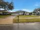 Traditional home featuring a well-manicured front yard, neutral paint and an attached two-car garage at 148 Blue Stone Cir, Winter Garden, FL 34787