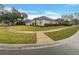 Beautiful home with manicured lawn and mature trees, conveniently located on a corner lot at 148 Blue Stone Cir, Winter Garden, FL 34787