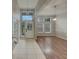 Inviting foyer with decorative lighting, tile flooring, and views into the living spaces at 148 Blue Stone Cir, Winter Garden, FL 34787