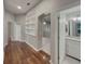 Hallway featuring an arched doorway and built-in shelving at 148 Blue Stone Cir, Winter Garden, FL 34787