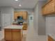 Bright kitchen featuring an island, granite countertops, stainless steel appliances, and ample cabinet space at 148 Blue Stone Cir, Winter Garden, FL 34787