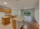 Eat-in kitchen featuring granite countertops, stainless steel appliances and kitchen island at 148 Blue Stone Cir, Winter Garden, FL 34787