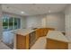 Eat-in kitchen with large island, granite countertops and stainless steel appliances at 148 Blue Stone Cir, Winter Garden, FL 34787
