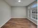 Spacious living room featuring new hardwood floors and plenty of natural light at 148 Blue Stone Cir, Winter Garden, FL 34787