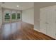 Living room showcasing wood floors, windows for natural light, and a closet at 148 Blue Stone Cir, Winter Garden, FL 34787