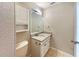 Cozy bathroom featuring a vanity with a granite countertop, tiled floors, and a mounted mirror at 759 Little Wekiva Cir, Altamonte Springs, FL 32714