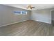 Large bedroom featuring hardwood floors, a ceiling fan, and a bright window at 759 Little Wekiva Cir, Altamonte Springs, FL 32714