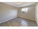 Neutral bedroom featuring ample natural light, wood flooring, and a closet at 759 Little Wekiva Cir, Altamonte Springs, FL 32714