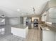Bright kitchen featuring white cabinets, granite countertops, stainless steel appliances, and an island at 759 Little Wekiva Cir, Altamonte Springs, FL 32714