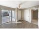 Living room with wood floors, sliding glass doors, and multiple closets at 759 Little Wekiva Cir, Altamonte Springs, FL 32714