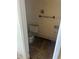 Bathroom featuring a toilet and tile floor, in need of repairs and renovations at 1165 S Lake Shore Way, Lake Alfred, FL 33850