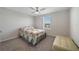 Well-lit bedroom with a window and seating, showcasing comfortable and inviting decor at 5692 Camilla St, St Cloud, FL 34771