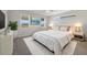 Serene bedroom features plush carpet, a cozy bed, and tranquil views from the window at 5692 Camilla St, St Cloud, FL 34771
