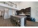 Well-appointed kitchen features island seating, stylish countertops, and modern appliances at 5692 Camilla St, St Cloud, FL 34771