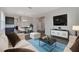Open concept living area seamlessly blends relaxation and dining with stylish finishes at 5692 Camilla St, St Cloud, FL 34771