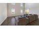 Inviting living room with comfortable seating, sleek wood floors and plenty of natural light at 5692 Camilla St, St Cloud, FL 34771