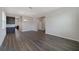 Expansive room showcases hardwood floors and neutral walls, with an adjacent dining area at 5692 Camilla St, St Cloud, FL 34771