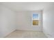 Neutral bedroom with carpet floors and a window at 410 Annabelle Way, Davenport, FL 33837