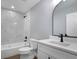 Modern bathroom with white vanity, marble shower, and bathtub at 1645 6Th Ave, Deland, FL 32724