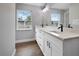 Bathroom with double vanity, modern fixtures and large mirror at 1645 6Th Ave, Deland, FL 32724