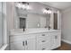 Bathroom with white cabinets, double vanity, and modern fixtures at 1645 6Th Ave, Deland, FL 32724