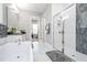 Modern bathroom with a large walk-in shower and double vanity at 8042 Ludington Cir, Orlando, FL 32836