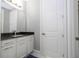 Modern bathroom with white cabinets and granite countertop at 8042 Ludington Cir, Orlando, FL 32836