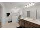 Bright bathroom features a glass shower, dual sinks, and modern fixtures at 687 Campo Ln, Davenport, FL 33837
