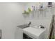 Laundry room with a new, side-by-side washer and dryer at 687 Campo Ln, Davenport, FL 33837