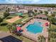 Aerial view of community pool, playground, and covered seating area at 687 Campo Ln, Davenport, FL 33837
