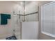 Glass-enclosed shower with tile accents, modern showerhead, and tiled walls at 687 Campo Ln, Davenport, FL 33837