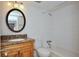 Clean bathroom with granite vanity and bathtub at 4791 S Texas Ave # 4791D, Orlando, FL 32839