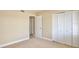 Bedroom with double closets and carpet at 4791 S Texas Ave # 4791D, Orlando, FL 32839