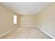 Simple bedroom with carpet and window at 4791 S Texas Ave # 4791D, Orlando, FL 32839