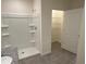 Bathroom with shower, granite vanity, and linen closet at 2453 Shiprock Ct, Deltona, FL 32738